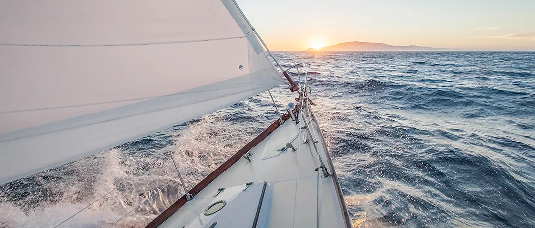 Boat owner applying coating to a hull
