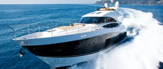 Yacht hull being spray-finished in a professional yard